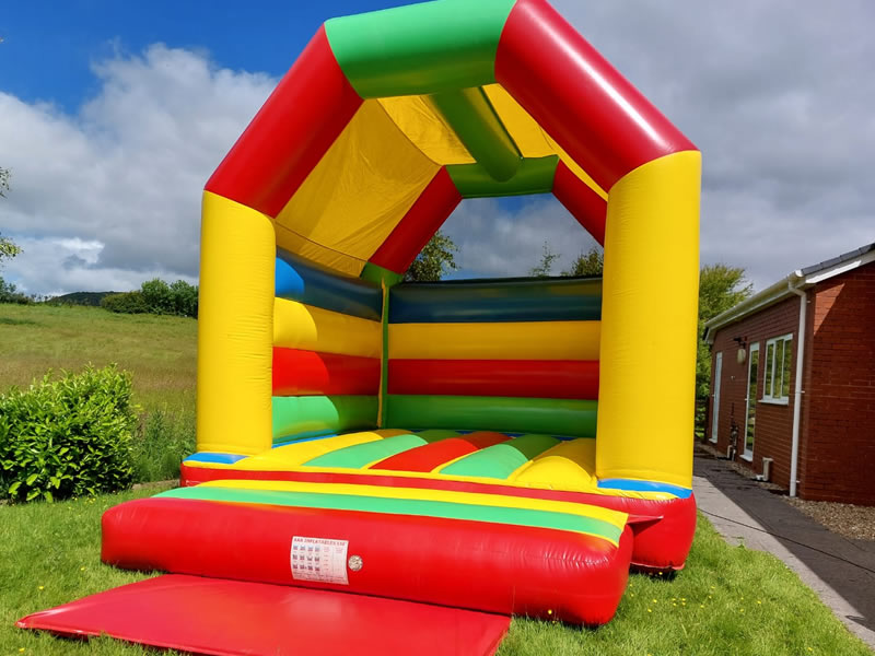 Large Rainbow Bouncy Castle Hire Wales